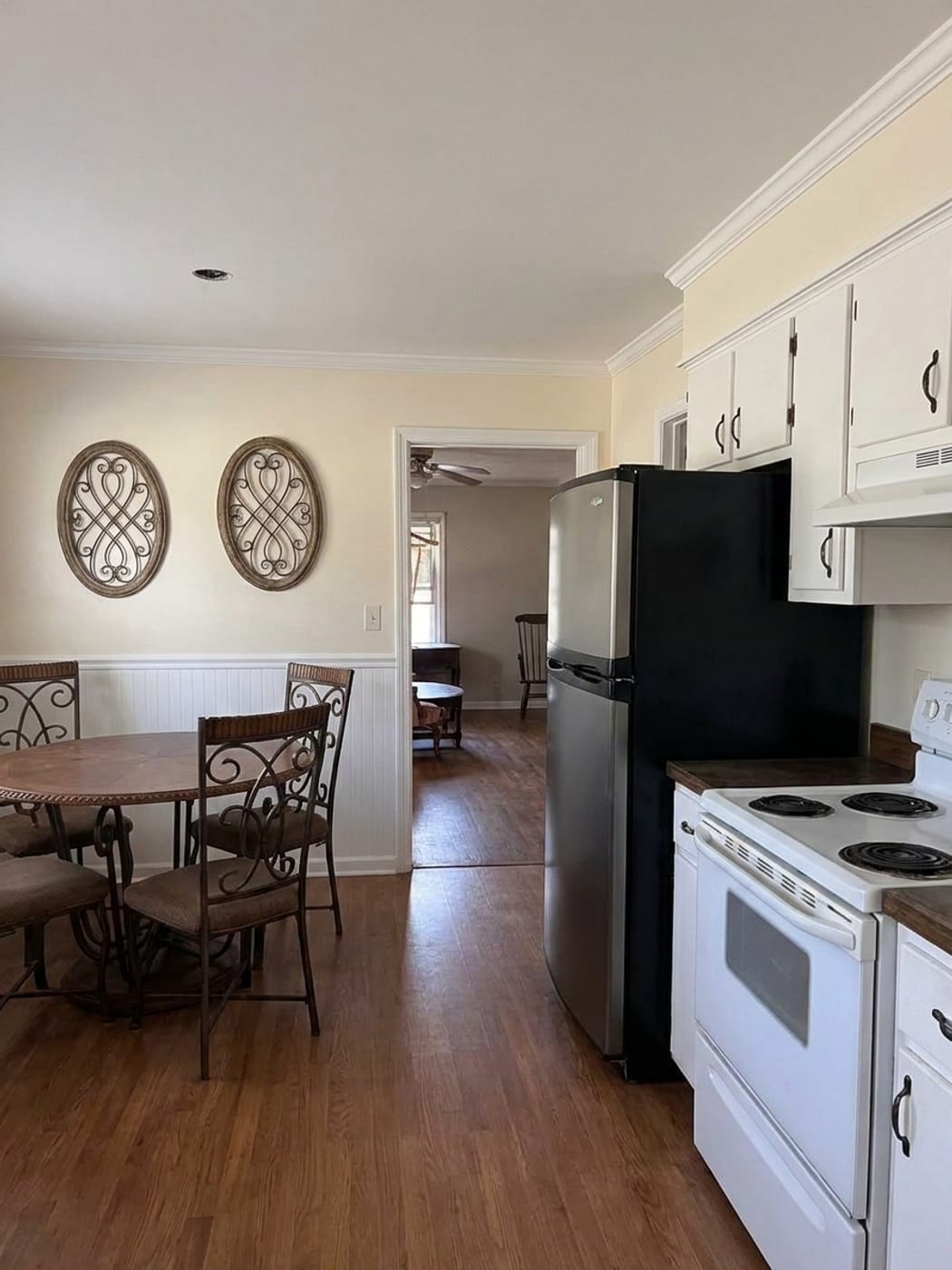 A kitchen restored after a fire, with the soot cleaned off and the cabinets and ceiling repaired